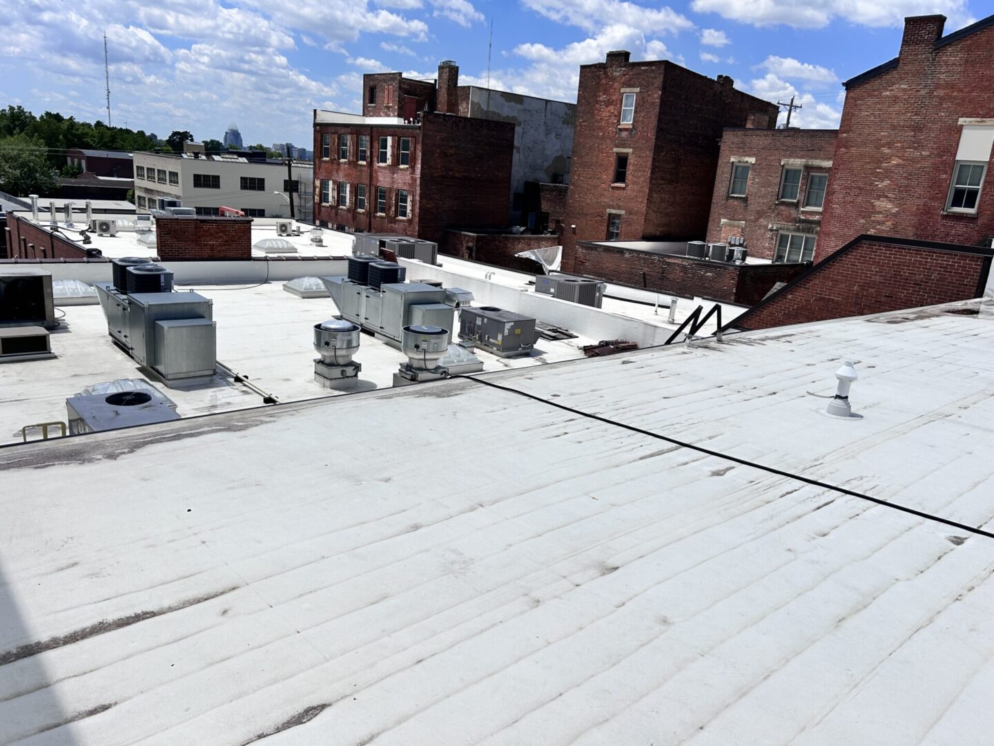 A roof with many buildings and air vents on it